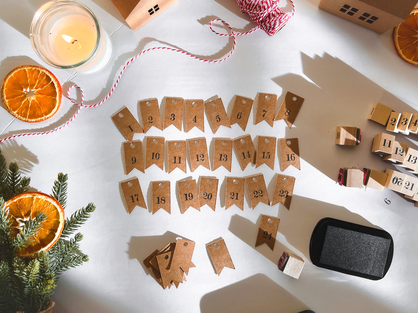 Hand-stamped Advent Calendar gift tags, numbered 1 through 24