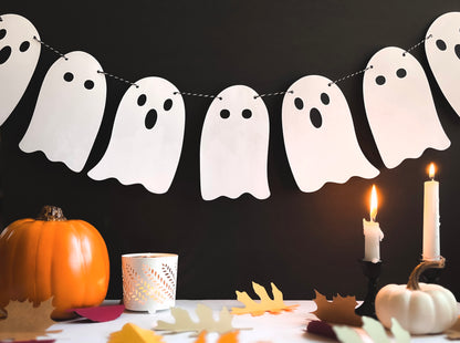 Paper Ghost Banner with seven cute white ghosts on a black & white baker's twine string. 