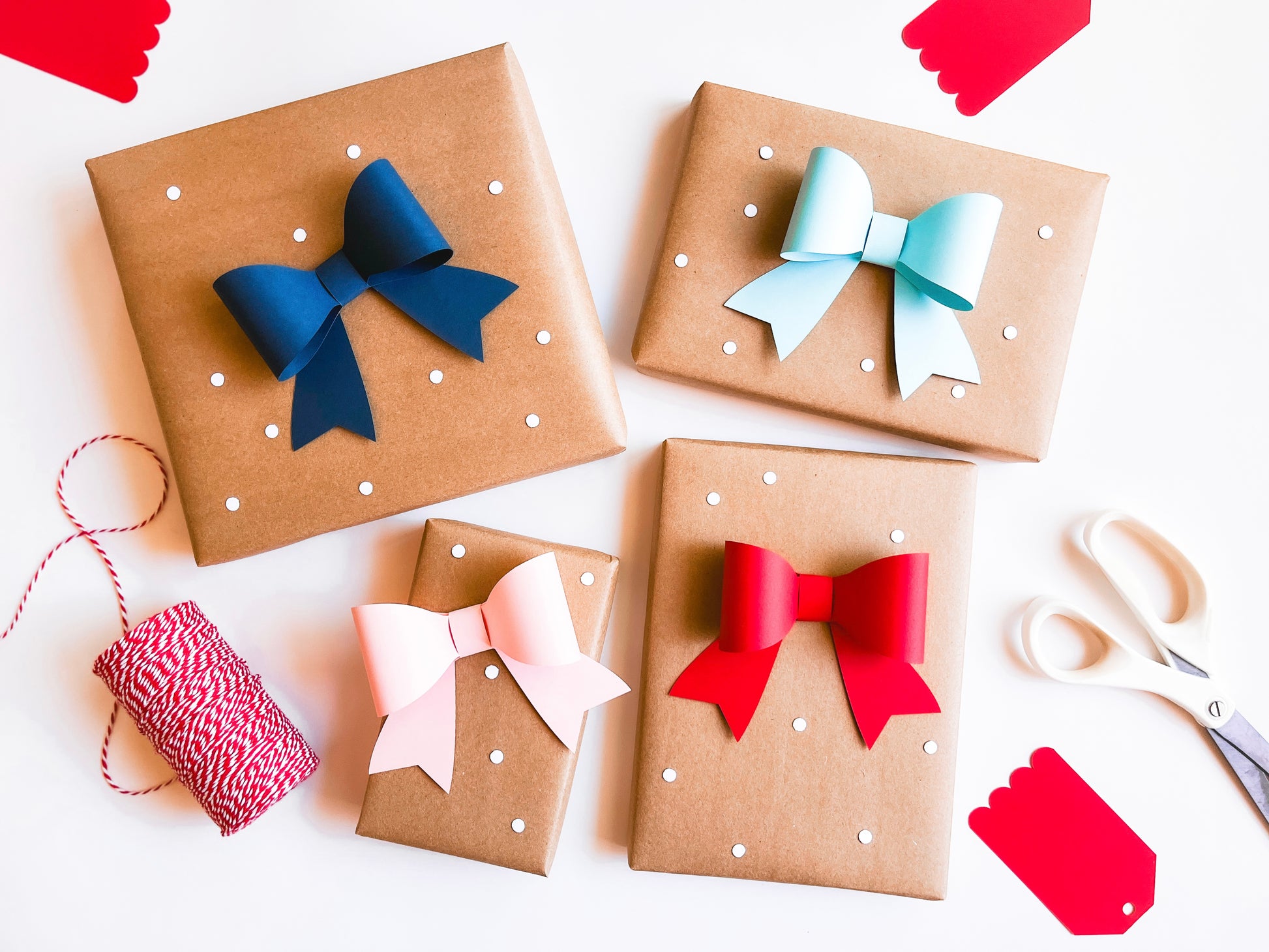 Paper 3D Gift Bows, Set of 12 in Red, Pink, Navy, and Light Blue, ready to attach to your gifts to make them extra special! 