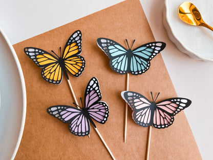 Set of 12 Paper Monarch Butterfly Cupcake Toppers, layered cardstock paper, cut in shape of butterflies in pastel colors on food safe picks for cupcakes or cake decor. 