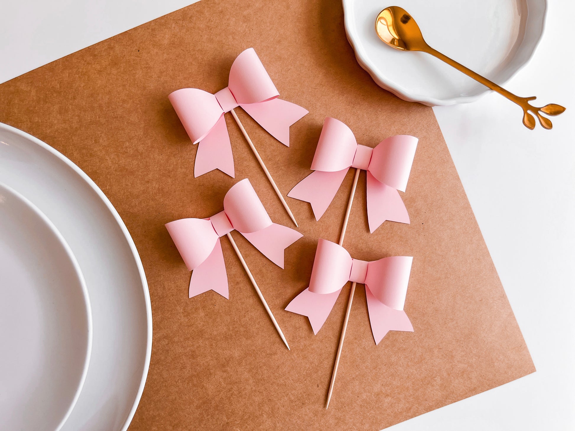 Set of 12 Pink Bow Cupcake Toppers, 3D Bow Shape affixed to food safe pick.